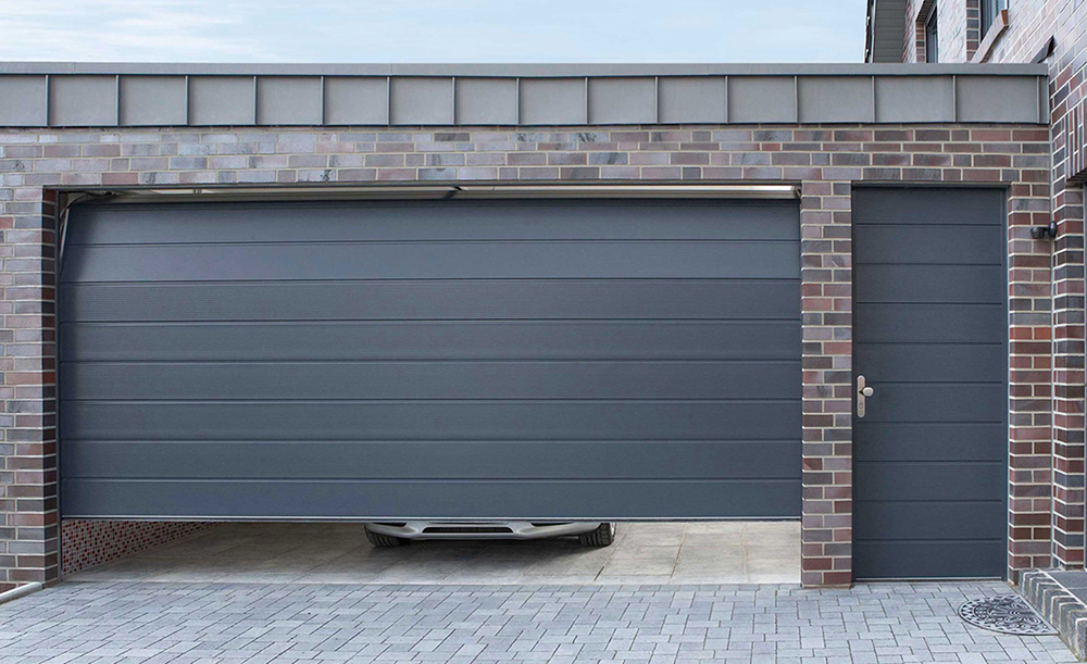 CarTeck Insulated Centre Ribbed Sectional Garage Door - Smooth Anthracite with a Matching Side Hinged Personnel Door