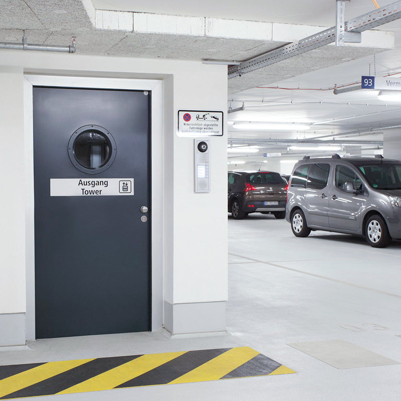 Single Steel Fire Door With Porthole Vision Panel Protecting A Carpark Access Point