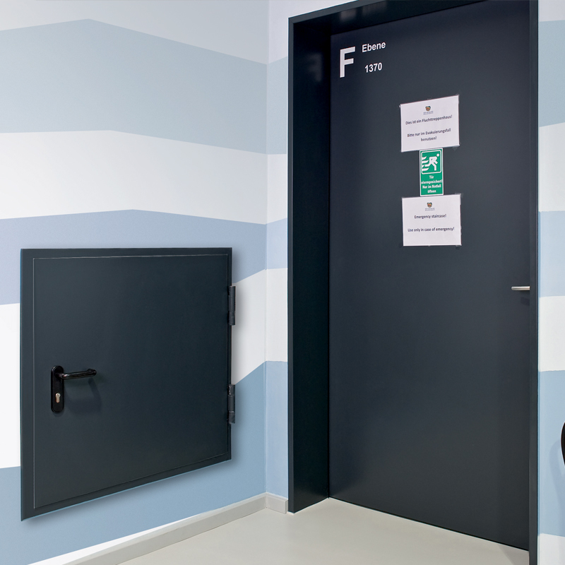 Steel Fire Door And A Steel Fire Hatch Protecting A Hotel Corridor And Utilities Shaft